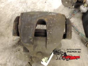 Used Front brake calliper, left Ford Focus 2 1.4 16V Price on request offered by Autosloperij Pieper BV