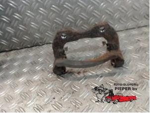 Used Front brake calliperholder, left Nissan Almera Tino (V10M) 1.8 16V Price on request offered by Autosloperij Pieper BV