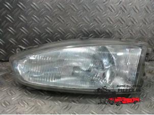 Used Headlight, left Mitsubishi Colt (CJ) 1.6 GLXi 16V Price € 36,75 Margin scheme offered by Autosloperij Pieper BV
