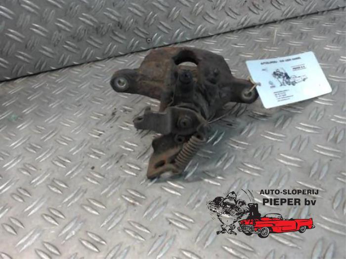 Rear brake calliper, left from a Ford Mondeo III 1.8 16V 2001