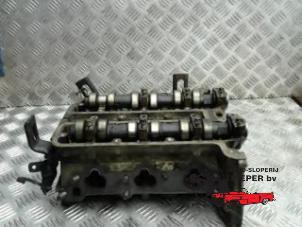Used Cylinder head Opel Corsa B (73/78/79) 1.0i 12V Price on request offered by Autosloperij Pieper BV
