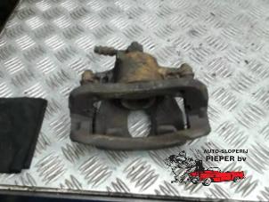 Used Front brake calliper, left Opel Corsa C (F08/68) 1.0 12V Twin Port Price € 36,75 Margin scheme offered by Autosloperij Pieper BV