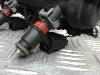 Fuel injector nozzle from a Seat Ibiza III (6L1) 1.2 12V 2007
