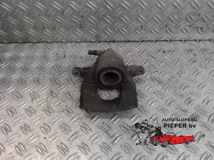 Used Front brake calliper, left Peugeot 107 1.0 12V Price € 36,75 Margin scheme offered by Autosloperij Pieper BV