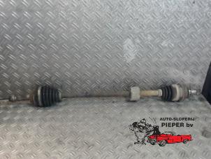 Used Front drive shaft, right Daihatsu Cuore (L251/271/276) 1.0 12V DVVT Price on request offered by Autosloperij Pieper BV