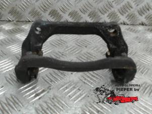 Used Front brake calliperholder, left Mini Mini (R56) 1.6 16V Cooper Price on request offered by Autosloperij Pieper BV