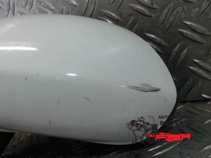 Wing mirror, left from a Opel Corsa D 1.4 16V Twinport 2009