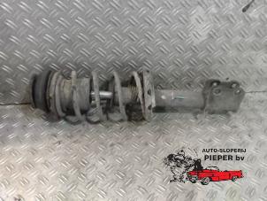 Used Front shock absorber rod, left Opel Corsa C (F08/68) 1.2 16V Price on request offered by Autosloperij Pieper BV