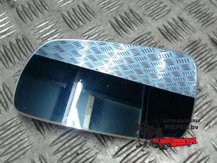 Mirror glass, left from a Audi A4 Avant (B5) 1.8 20V 1996
