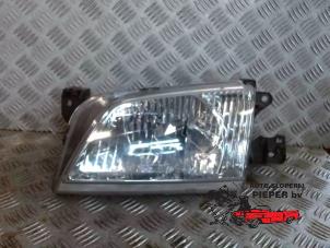 Used Headlight, left Mazda Demio (DW) 1.5 16V Price € 36,75 Margin scheme offered by Autosloperij Pieper BV