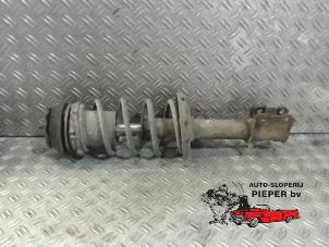 Used Front shock absorber rod, left Opel Corsa C (F08/68) 1.0 12V Price on request offered by Autosloperij Pieper BV