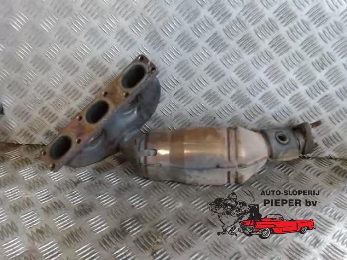 Exhaust manifold + catalyst from a BMW 3 serie (E46/4) 320i 24V 1999