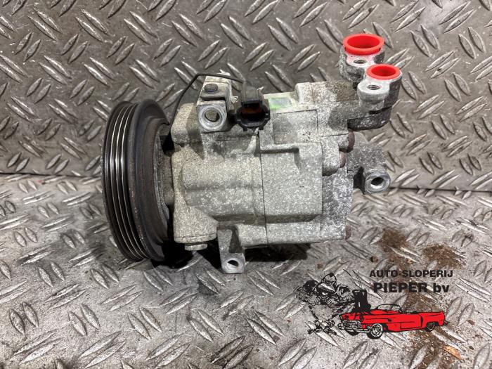 Usagé Compresseur de clim Nissan Micra (K12) 1.2 16V Prix € 78,75 Règlement à la marge proposé par Autosloperij Pieper BV