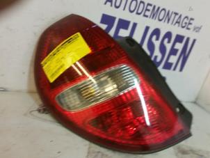 Used Taillight, left Daihatsu Sirion/Storia (M1) 1.3 16V DVVT Price on request offered by Zelissen V.O.F. autodemontage