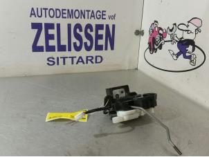 Used Tailgate lock mechanism Mazda 2 (NB/NC/ND/NE) 1.4 16V Price € 47,25 Margin scheme offered by Zelissen V.O.F. autodemontage