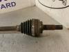 Front drive shaft, left from a Toyota Yaris (P1) 1.3 16V VVT-i 2002