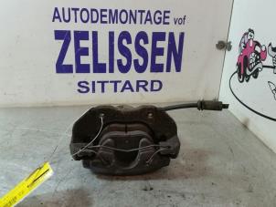 Used Front brake calliper, left Ford Focus 2 Wagon 1.6 16V Price € 26,25 Margin scheme offered by Zelissen V.O.F. autodemontage