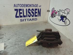 Used Front brake calliper, left Mini Mini (R56) 1.6 16V One Price € 42,00 Margin scheme offered by Zelissen V.O.F. autodemontage