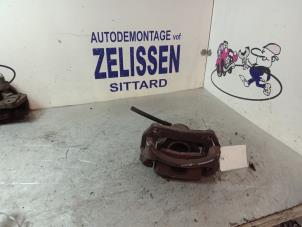 Used Rear brake calliper, left Mazda 2 (DE) 1.3 16V S-VT Price € 42,00 Margin scheme offered by Zelissen V.O.F. autodemontage