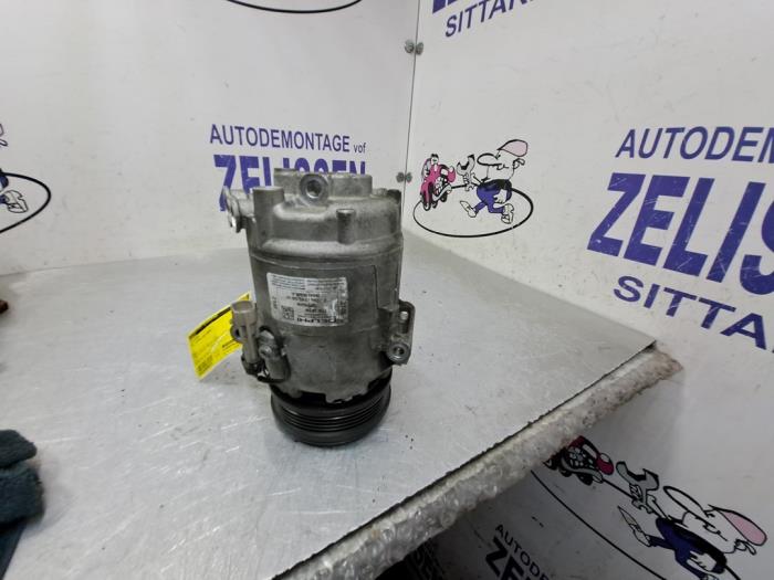 Air conditioning pump from a Opel Astra H SW (L35) 1.8 16V 2006