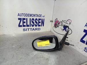 Usagé Rétroviseur gauche Nissan Almera (N16) 1.5 16V Prix € 36,75 Règlement à la marge proposé par Zelissen V.O.F. autodemontage