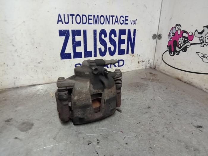 Front brake calliper, left from a Opel Corsa D 1.4 16V Twinport 2007
