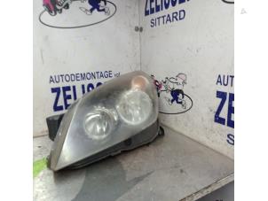 Używane Reflektor lewy Opel Astra H (L48) 1.4 16V Twinport Cena € 52,50 Procedura marży oferowane przez Zelissen V.O.F. autodemontage