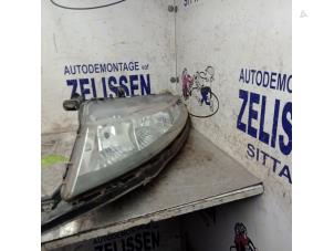 Used Headlight, left Honda Civic (FK/FN) 1.4i Type S 16V Price € 131,25 Margin scheme offered by Zelissen V.O.F. autodemontage