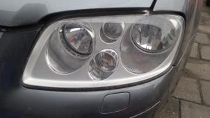 Używane Reflektor lewy Volkswagen Touran Cena na żądanie oferowane przez Bongers Auto-Onderdelen Zeeland