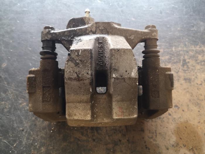 Rear brake calliper, left from a Toyota Prius Plus (ZVW4) 1.8 16V 2014