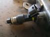 Injector (petrol injection) from a Renault Megane Scenic 2009