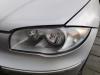 Headlight, left from a BMW 1 serie (E87/87N), 2003 / 2012 118i 16V, Hatchback, 4-dr, Petrol, 1.995cc, 95kW (129pk), RWD, N46B20, 2004-07 / 2007-02, UF31 2006