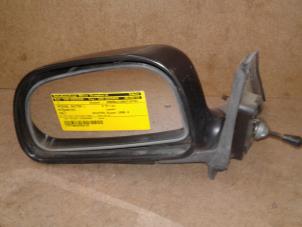 Used Wing mirror, left Mitsubishi Colt (CJ) 1.3 GL,GLX 12V Price on request offered by Akkie Stomphorst Autodemontage