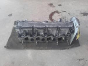 Used Cylinder head Renault Megane II CC (EM) 1.9 dCi 130 Price on request offered by Akkie Stomphorst Autodemontage