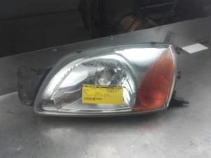 Used Headlight, left Ford Fiesta 4 1.25 16V Price on request offered by Akkie Stomphorst Autodemontage