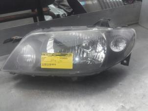 Used Headlight, left Mazda 323F Price on request offered by Akkie Stomphorst Autodemontage