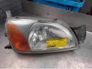 Used Headlight, right Ford Fiesta 4 1.3i Price on request offered by Akkie Stomphorst Autodemontage