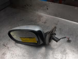 Used Wing mirror, left Nissan Almera (N16) 1.8 16V Price on request offered by Akkie Stomphorst Autodemontage