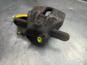 Used Front brake calliper, left Nissan Micra (K12) 1.2 16V Price € 30,00 Margin scheme offered by Akkie Stomphorst Autodemontage