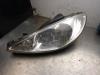 Headlight, left from a Peugeot 206 (2A/C/H/J/S) 1.6 16V 2002