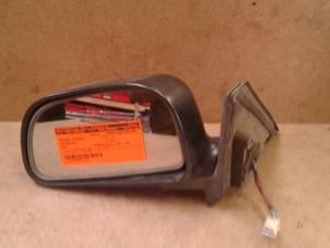 Used Wing mirror, left Mitsubishi Colt (CJ) 1.6 GLXi 16V Price on request offered by Akkie Stomphorst Autodemontage