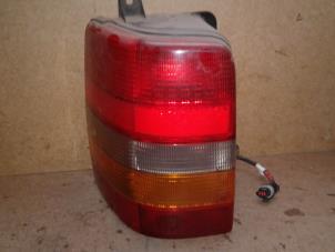 Used Taillight, left Jeep Grand Cherokee (WG/WJ) 4.0i Price on request offered by Akkie Stomphorst Autodemontage