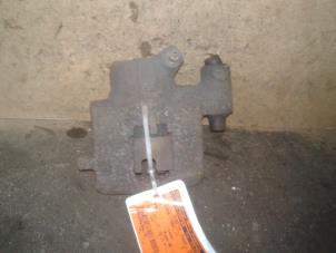 Used Front brake calliper, left Fiat Punto II (188) 1.2 60 S Price on request offered by Akkie Stomphorst Autodemontage