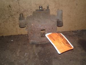 Used Front brake calliper, left Mazda 626 (GF14) 2.0i 16V Price on request offered by Akkie Stomphorst Autodemontage