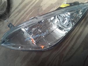 Used Headlight, left Mitsubishi Colt Price on request offered by Akkie Stomphorst Autodemontage