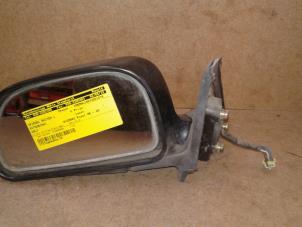 Used Wing mirror, left Mitsubishi Colt (CJ) 1.6 GLXi 16V Price on request offered by Akkie Stomphorst Autodemontage