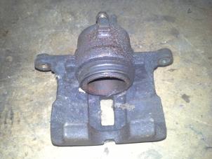 Used Front brake calliper, left Nissan Almera Price on request offered by Akkie Stomphorst Autodemontage