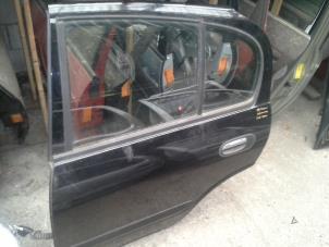 Used Rear door 4-door, left Nissan Almera Price on request offered by Akkie Stomphorst Autodemontage