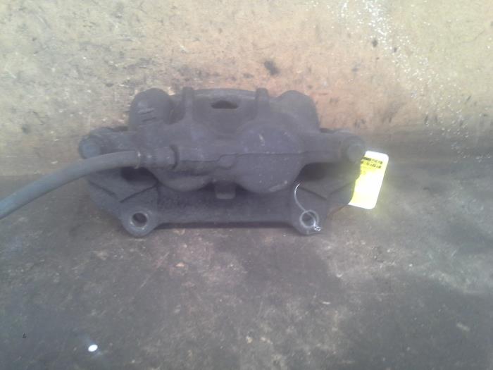 Front brake calliper, left from a Opel Vivaro 2.0 CDTI 2010