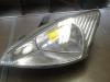 Headlight, left from a Ford Focus 1 1.8 16V 1999